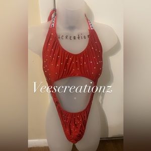 A creation sewn by me,  a red onesie with rhinestones